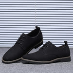 Men's casual hiking-style shoes in black, blue, brown, and gray